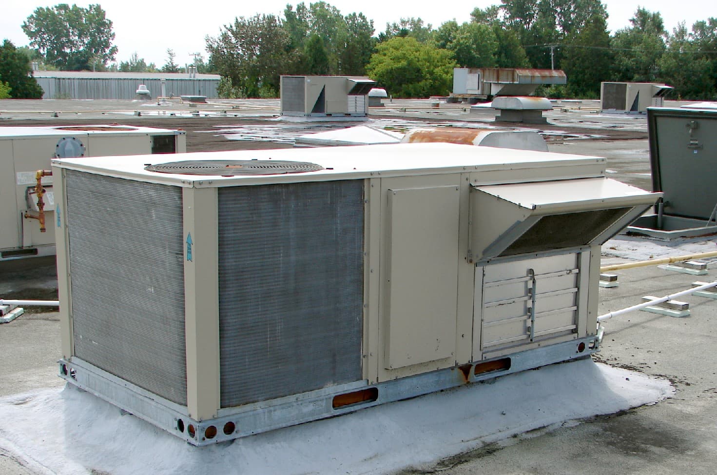 Packaged rooftop HVAC units on a commercial flat roof